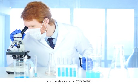 Scientist using Microscope in Laboratory for Research