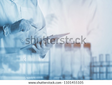 scientist using tablet in the laboratory,Laboratory research concept,science background