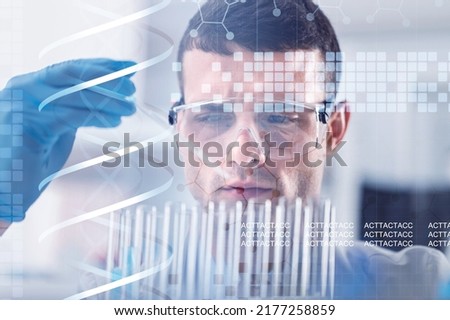 Scientist with virtual screen with data scientific at genetic engineering lab. Biomedical engineer genetic working with microtubes in biotechincal laboratory