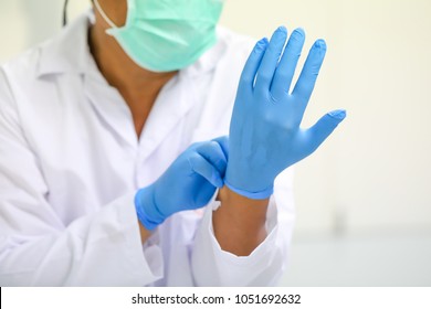 scientist wearing glove.