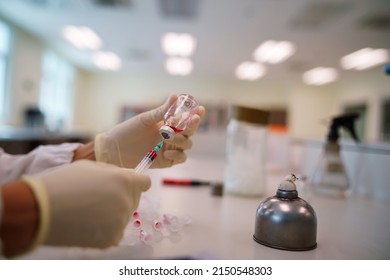 Scientist Wearing Medical Gloves Use Syringe Mix Red Color Solutions For Carbohydrate Fermentation Test, Acid Detection, Laboratory Concept.