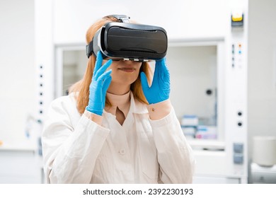 Scientist wearing VR glasses for making experiments in virtual reality in modern laboratory. - Powered by Shutterstock