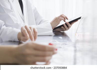 The scientist who is experimenting using an electronic tablet - Powered by Shutterstock