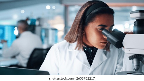 Scientist, woman and microscope in lab, study and process for medical research for human genome sequence. Person, review and test for sample with clinical trial, investigation and DNA analysis