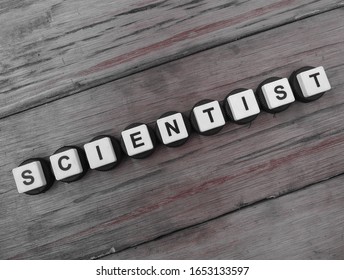 Scientist, word cube with background.