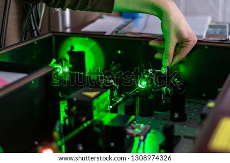 scientist work with laser machine or system