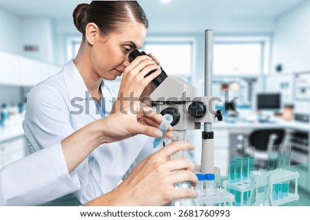 Scientist worker analyze biochemical samples in laboratory.