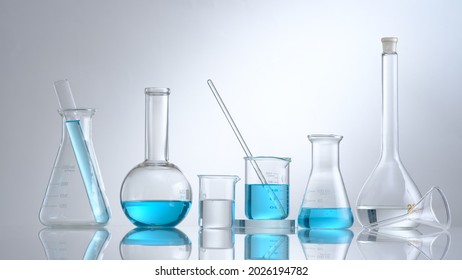 Scientist working with chemical reaction in chemistry laboratory. close up of scientist making research in lab in white background