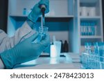 a scientist is working in a laboratory, a chemical researcher is preparing sample for a vaccine against a virus, work in lab concentrate is the most important because chemicals are dangerous