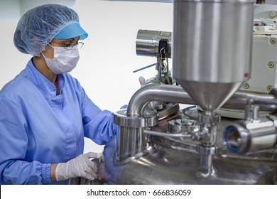 Scientist Working at the Laboratory. Female Scientist Wearing Protective Clothing in Pharmaceutical Lab. Developing New Medicines in lab. Biomedical Research. Pharmaceutical Industry Worker at Work. - Shutterstock ID 666836059