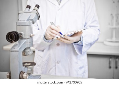 Scientist working in laboratory looking results - Shutterstock ID 742730905