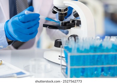 Scientist working microscope doing research in laboratory. Scientist in a lab, adjusting a microscope, evoking precision and scientific inquiry.