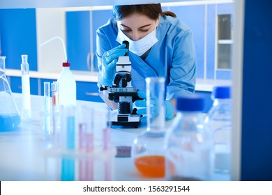 Scientist working with microscope indoors. Laboratory analysis