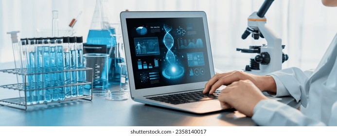 Scientist working on advance biotechnology computer software to study or analyze DNA data after making scientific breakthrough from chemical experiment on medical laboratory. Neoteric - Powered by Shutterstock