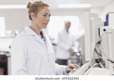 Scientist Working In Pathology Lab