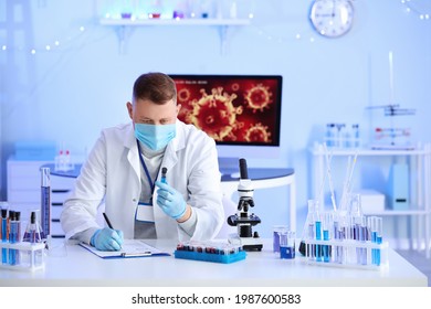 Scientist working with sample in laboratory
