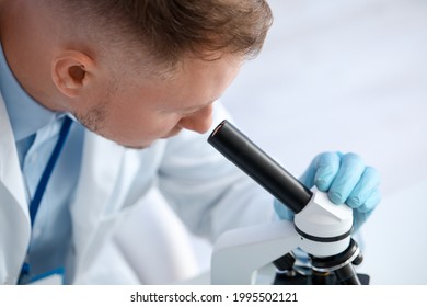 Scientist working with sample in laboratory