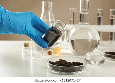 Scientist Working With Soil In Laboratory