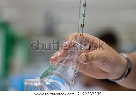 Scientist working Titration technique in the laboratory. 