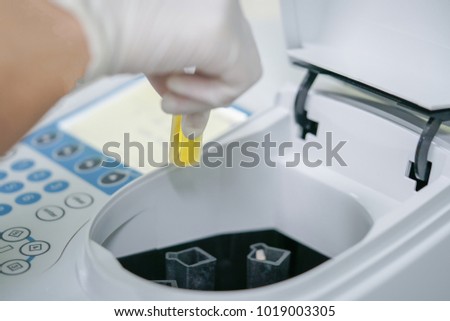 Scientist working at water quality test use by Spectrophotometer in the laboratory 