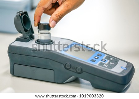 Scientist working at water quality test  use by Spectrophotometer in the laboratory 