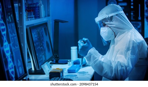 Scientist Works In A Modern Scientific Lab Using Laboratory Equipment, Microscope And Computer Technology. Invention Of New Vaccines. Concept Of Science And Health.