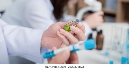 Scientists Analyzing Chemical Solutions for Breakthrough Laboratory Research - Powered by Shutterstock