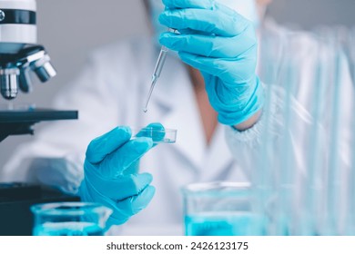 Scientists are conducting experiments, researching, and analyzing in the field of biochemistry, collaborating with a microscope to develop a vaccine. - Powered by Shutterstock