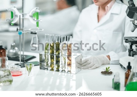 Scientists examining plant and algae samples in a modern laboratory, conducting pharmaceutical research to develop innovative medicine and explore natural treatments through advanced biotechnology