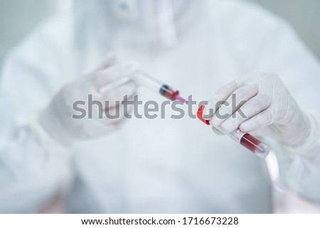 Scientists experiment in labs with test tubes to find a vaccine against coronavirus