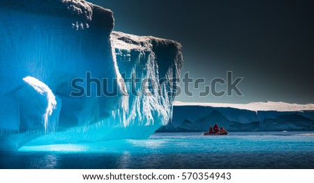 Scientists Explore Antarctic Icebergs by Boat