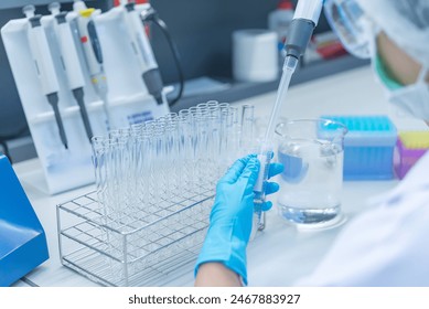 The scientists injected chemicals into plastic tubes,Scientist mix chemicals with The shake machine Before the experiment.Mixture laced with samples into test tubes,prepare sample for test - Powered by Shutterstock