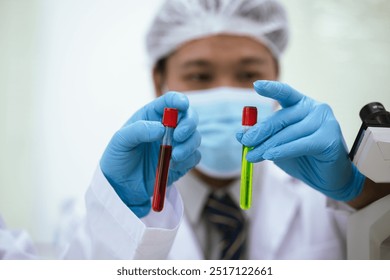 Scientists in a laboratory in Asia are conducting medical tests by analyzing chemical samples under a microscope to advance biotechnology research into disease and stem cells. - Powered by Shutterstock