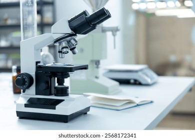 Scientist's microscope for magnifying samples and testing chemicals in lab