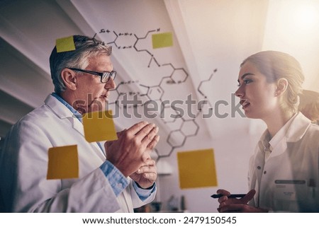 Scientists, notes and solution with research, writing and innovation for experiment or medical in laboratory. Man, woman and glass wall with ideas, pharmaceuticals and science formula for drugs