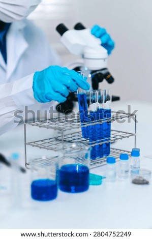 Scientists perform biochemical tests in a laboratory for health care innovation