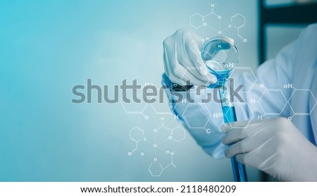 Scientists are preparing test tubes containing a large number of chemical and chemical structural formulas in the Science Laboratory to research antiretroviral drugs, a future world maintenance idea.