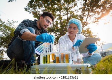 Scientists Team Collect Water Samples For Analysis And Research On Water Quality, Environment With Saving Earth.