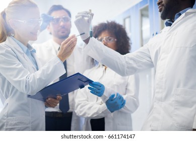 Scientists Team Working In Laboratory Doing Research, Man And Woman Making Scientific Experiments Doctors In Lab