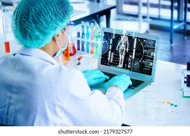 Scientists are using laptop to research cancer or covid treatment in lab. medical human body analysis technology. Scientific research with intelligent AI system innovation Develop an antiviral vaccine - Shutterstock ID 2179327577