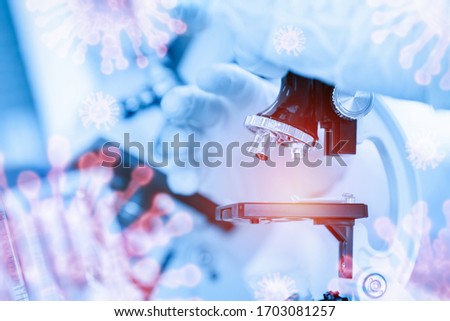 Scientists using microscope researching vaccines for protection against viruses (Corona or Covid-19 and influenza virus) in science laboratory