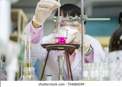 Scientists are watching the temperature in the thermomist to find the melting point of the chemical in the laboratory. - Powered by Shutterstock