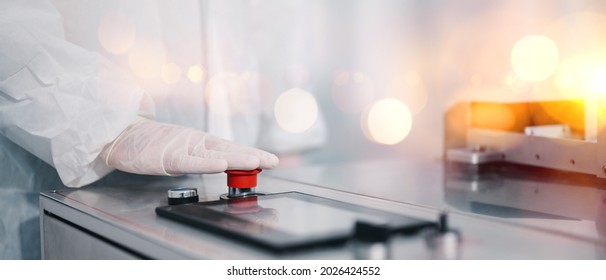 Scientists Wearing Protective Clothing Inspect Mask Making Machines In A Laboratory At An Industrial Plant. Anti-virus Production Warehouse. Concept Of Safety And Prevention Coronavirus Covid-19.