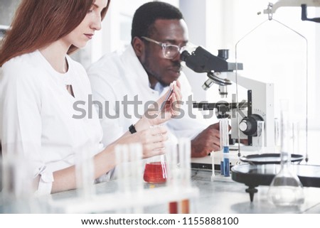 Scientists work closely with the microscope in the laboratory by conducting experiments and analyzes