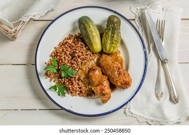 Scions of beef with buckwheat and pickled cucumber - Shutterstock ID 250458850