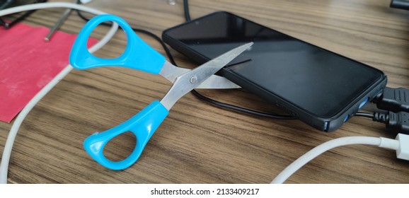 Scissor Cutting A Cell Phone. Removing. Offline. Scissors. Changing Cell Phone. Damaging Mobile Phone. Out Of Order. Denial, Denying To Use The Phone. No Carrier, No Signal. Issue, No Service Lost.