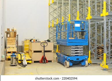 Scissor Lift At Construction Site In Distribution Warehouse