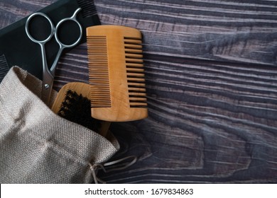 Scissors, Brush And Combs Inside A Bag. Kit For Grooming A Perfect Beard. Top View. Flat Lay. Copy Space.