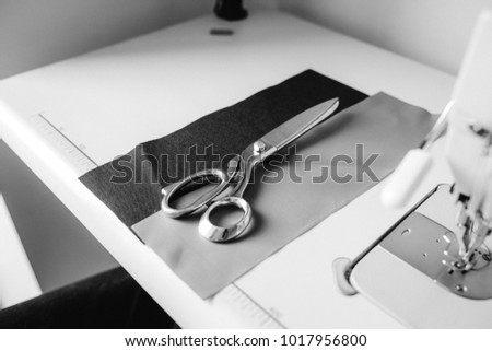 Scissors and cloth on the sewing table