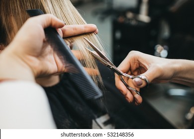 Scissors cut the girls hair - Shutterstock ID 532148356